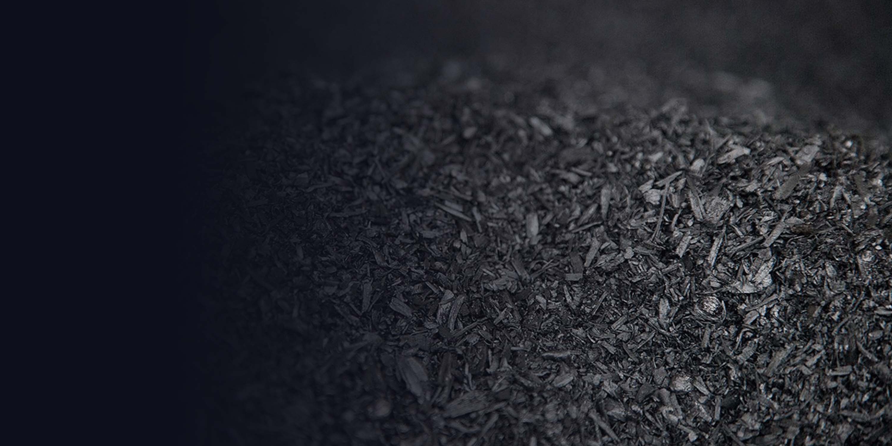 Biochar granules on a dark background